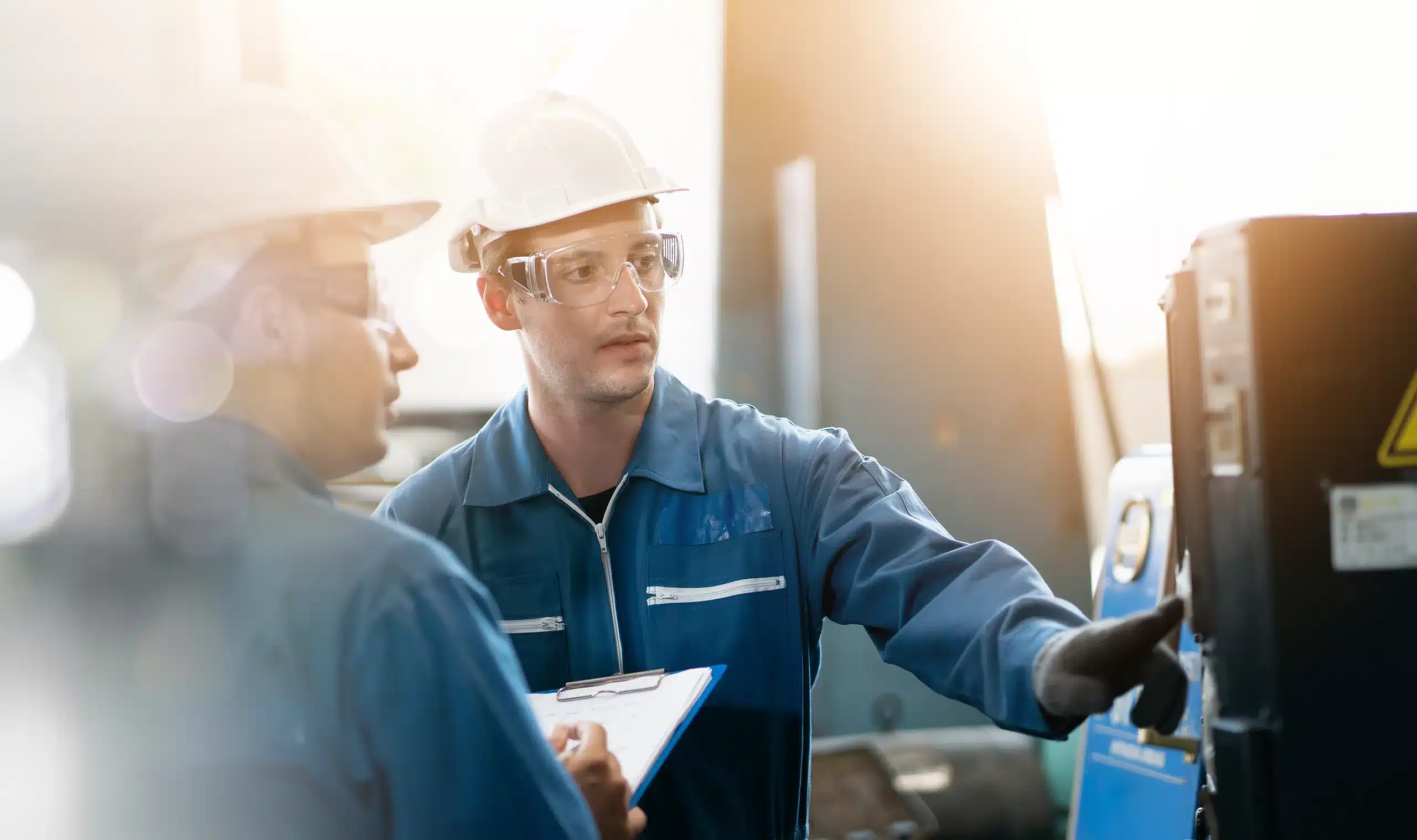 Engineers discussing equipment